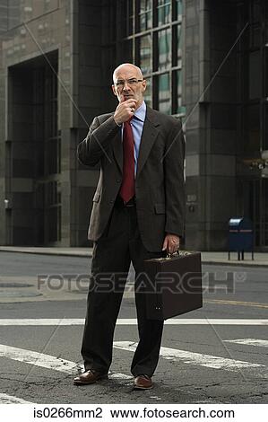 Confused looking businessman View Large Photo Image Stock Image - Confused looking businessman. Fotosearch