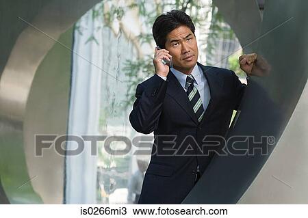 Japanese businessman on the phone View Large Photo Image Stock Image - Japanese businessman on the phone. Fotosearch