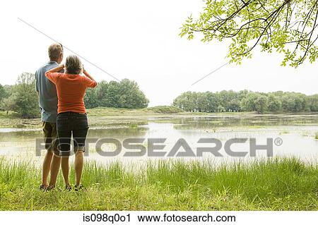 Couple birdwatching View Large Photo Image Stock Image - Couple birdwatching. Fotosearch