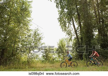 Stock Image - Couple cycling. Fotosearch