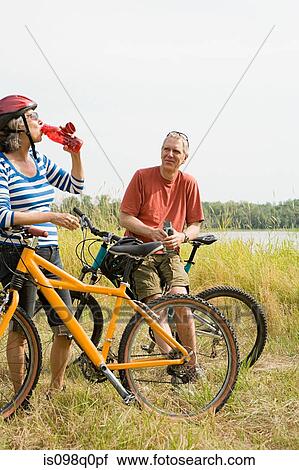 Cyclist couple View Large Photo Image Stock Image - Cyclist couple. Fotosearch