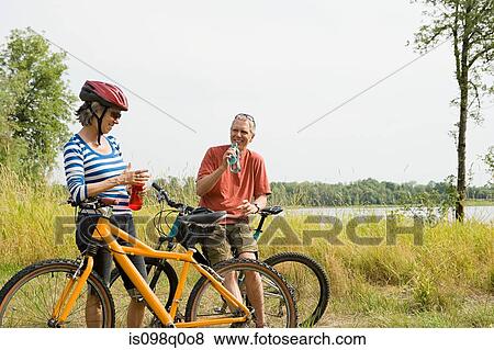 Cyclist couple View Large Photo Image Stock Photo - Cyclist couple. Fotosearch