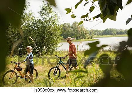 Cyclist couple View Large Photo Image Stock Photo - Cyclist couple. Fotosearch