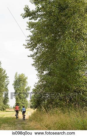 Cyclist couple View Large Photo Image Stock Photograph - Cyclist couple. Fotosearch