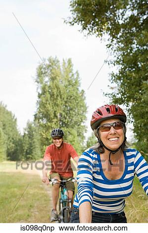 Stock Photography - Cyclist couple. Fotosearch