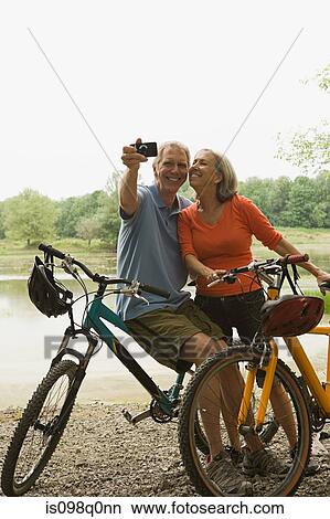 Picture - Cyclists with camera. Fotosearch