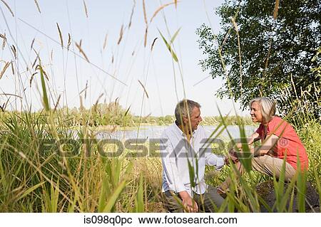 Mature couple in countryside View Large Photo Image Stock Image - Mature couple in countryside. Fotosearch