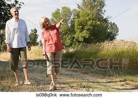 Mature couple in field View Large Photo Image Stock Image - Mature couple in field. Fotosearch