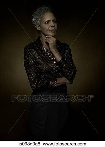 Portrait of a mature woman View Large Photo Image Stock Photo - Portrait of a mature woman. Fotosearch