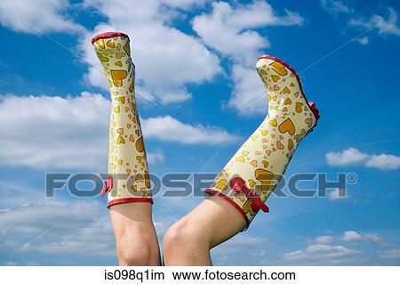 Picture - Person wearing rubber boots. Fotosearch