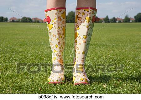 Stock Photo - Person wearing rubber boots. Fotosearch