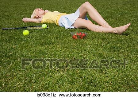 Tennis player lying down View Large Photo Image Stock Photo - Tennis player lying down. Fotosearch