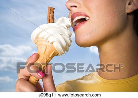 Woman eating ice cream View Large Photo Image Stock Image - Woman eating ice cream. Fotosearch