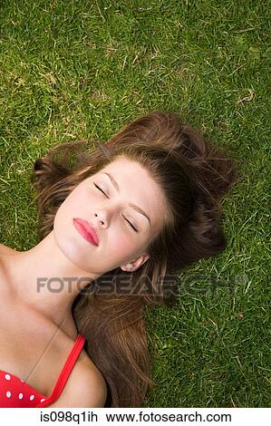 Woman sunbathing View Large Photo Image Stock Image - Woman sunbathing. Fotosearch