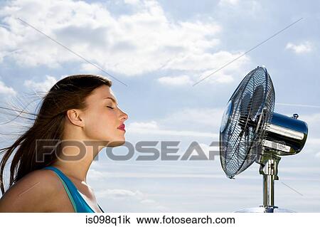 Young woman and fan View Large Photo Image Stock Image - Young woman and fan. Fotosearch