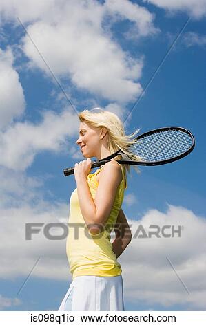Young woman with tennis racket View Large Photo Image Picture - Young woman with tennis racket. Fotosearch