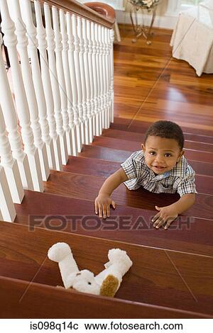 A boy climbing stairs View Large Photo Image Stock Image - A boy climbing stairs. Fotosearch