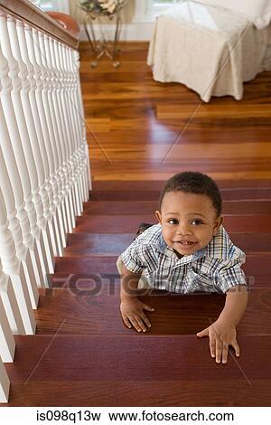 A boy climbing stairs View Large Photo Image Stock Photo - A boy climbing stairs. Fotosearch