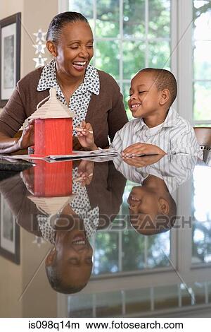 A grandmother and grandson painting a birdhouse View Large Photo Image Picture - A grandmother and grandson painting a birdhouse. Fotosearch