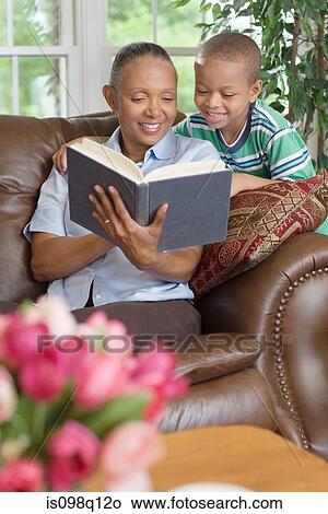 A grandmother and grandson reading a book View Large Photo Image Picture - A grandmother and grandson reading a book. Fotosearch