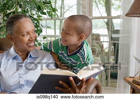 A grandmother and grandson reading a book View Large Photo Image Stock Image - A grandmother and grandson reading a book. Fotosearch