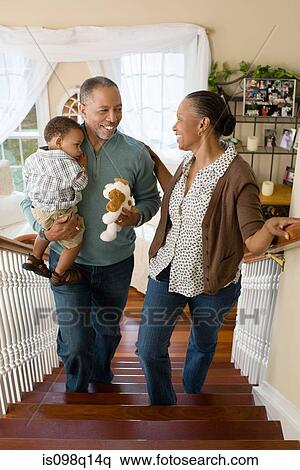 Grandparents carrying their grandson upstairs View Large Photo Image Stock Photography - Grandparents carrying their grandson upstairs. Fotosearch