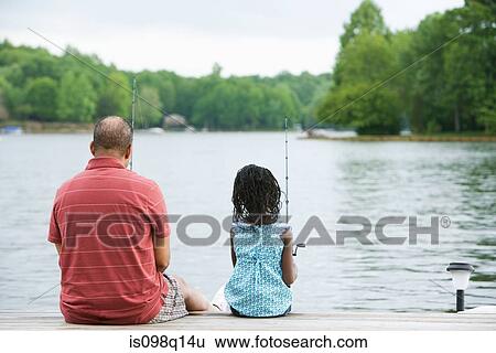 Rear view of a grandfather and granddaughter fishing View Large Photo Image Stock Photograph - Rear view of a grandfather and granddaughter fishing. Fotosearch