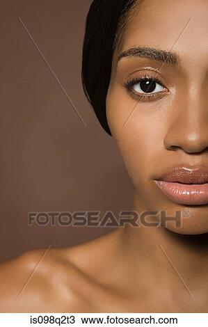 Cropped portrait of a young woman View Large Photo Image Stock Image - Cropped portrait of a young woman. Fotosearch