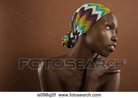 Stock Image - Portrait of a young woman wearing a headscarf. Fotosearch