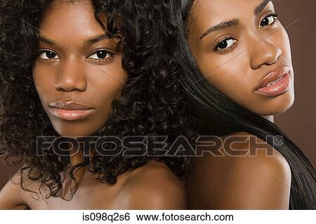 Stock Photograph - Portrait of two young women. Fotosearch