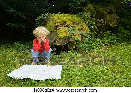 A boy with a map View Large Photo Image Picture - A boy with a map. Fotosearch