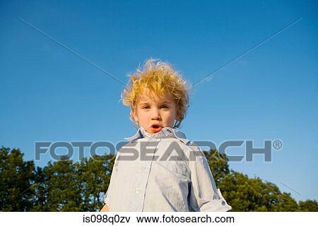 Portrait of a boy making faces View Large Photo Image Stock Photo - Portrait of a boy making faces. Fotosearch