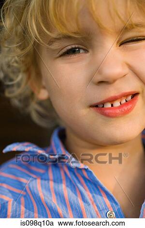 Portrait of a boy winking View Large Photo Image Stock Image - Portrait of a boy winking. Fotosearch