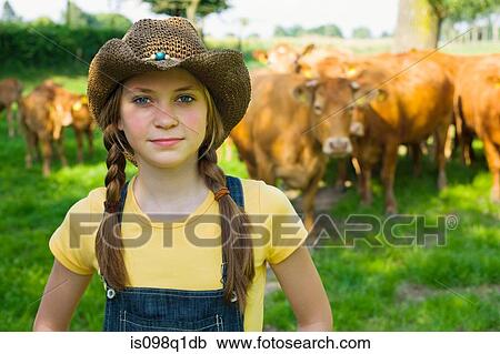 Stock Image - Portrait of a girl on a farm. Fotosearch