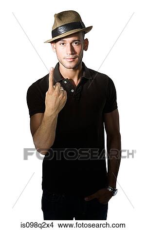 Portrait of a young man holding one finger up View Large Photo Image Picture - Portrait of a young man holding one finger up. Fotosearch