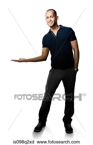 Stock Image - Portrait of a young man with his arms open. Fotosearch