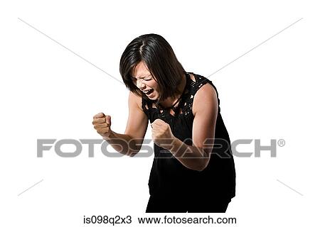 Stock Image - Portrait of a young woman shouting. Fotosearch