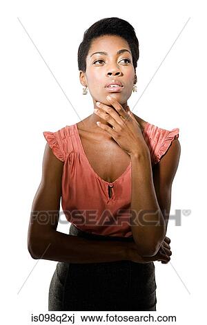 Stock Image - Portrait of a young woman thinking. Fotosearch