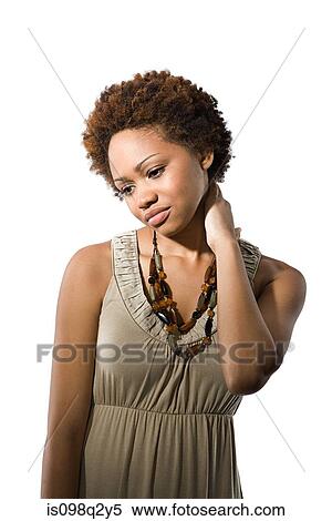Stock Photography - Portrait of a young woman thinking. Fotosearch