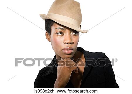 Portrait of a young woman with her hand on her chin View Large Photo Image Stock Image - Portrait of a young woman with her hand on her chin. Fotosearch