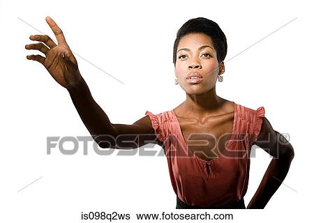 Portrait of a young woman with her hand raised View Large Photo Image Stock Photograph - Portrait of a young woman with her hand raised. Fotosearch