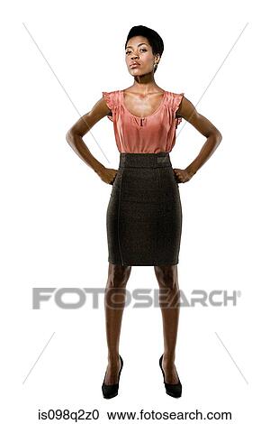 Portrait of a young woman with her hands on her hips View Large Photo Image Stock Image - Portrait of a young woman with her hands on her hips. Fotosearch