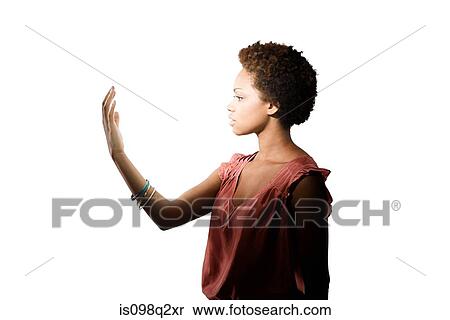 Young woman looking at her hand View Large Photo Image Stock Photography - Young woman looking at her hand. Fotosearch