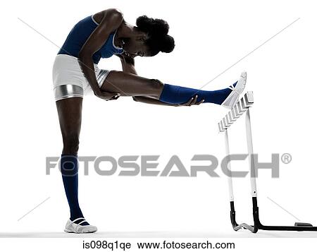 A hurdler stretching View Large Photo Image Stock Image - A hurdler stretching. Fotosearch