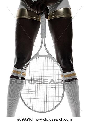 A woman holding a tennis racket View Large Photo Image Stock Image - A woman holding a tennis racket. Fotosearch