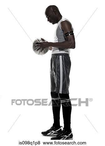 Stock Photo - A young man holding basketball. Fotosearch