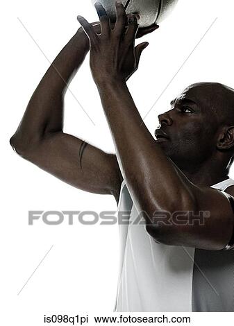 A young man playing basketball View Large Photo Image Stock Image - A young man playing basketball. Fotosearch