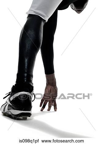 An american football player touching the floor View Large Photo Image Stock Image - An american football player touching the floor. Fotosearch