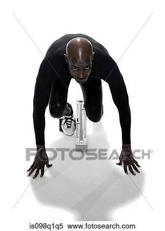 Athlete on starting blocks View Large Photo Image Stock Photography - Athlete on starting blocks. Fotosearch