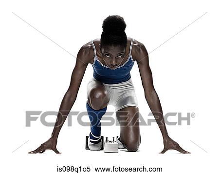 Stock Photography - Young woman at starting blocks. Fotosearch